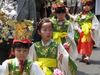 Child taking part in a festive procession The procession going slowly